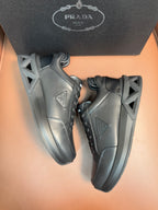 Prada dark leather sneakers, side logo triangle and lace-up design