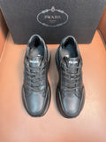 Prada dark sneakers, lace-up front and logo on tongue