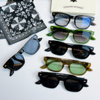 Chrome glasses set with assorted frames: green, gold, and black with tinted lenses