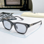 Chrome glasses with black frame and clear-blue lenses, front view