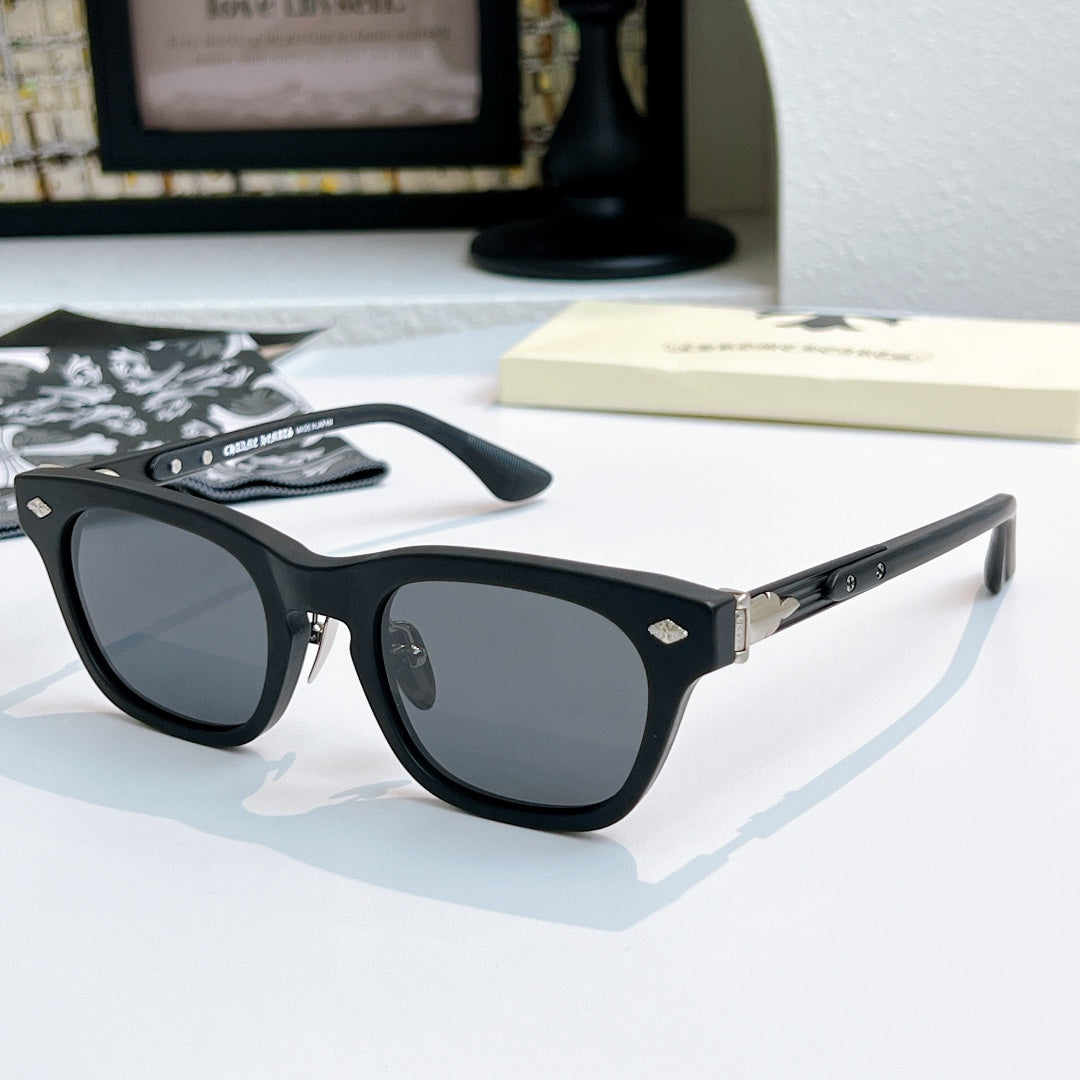 Chrome glasses with black frame and dark lenses, angled front view