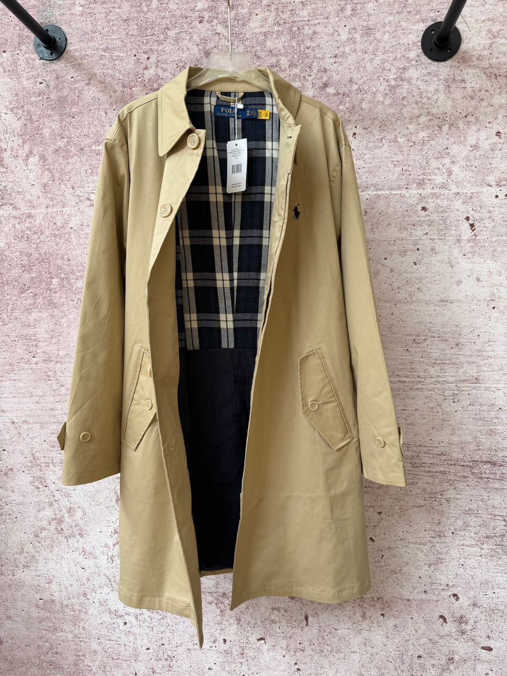 Tan long coat open view with plaid lining, notched lapels, and front button.