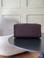 Chanel bag dark plum quilted leather flap clutch with gold hardware and stitched top