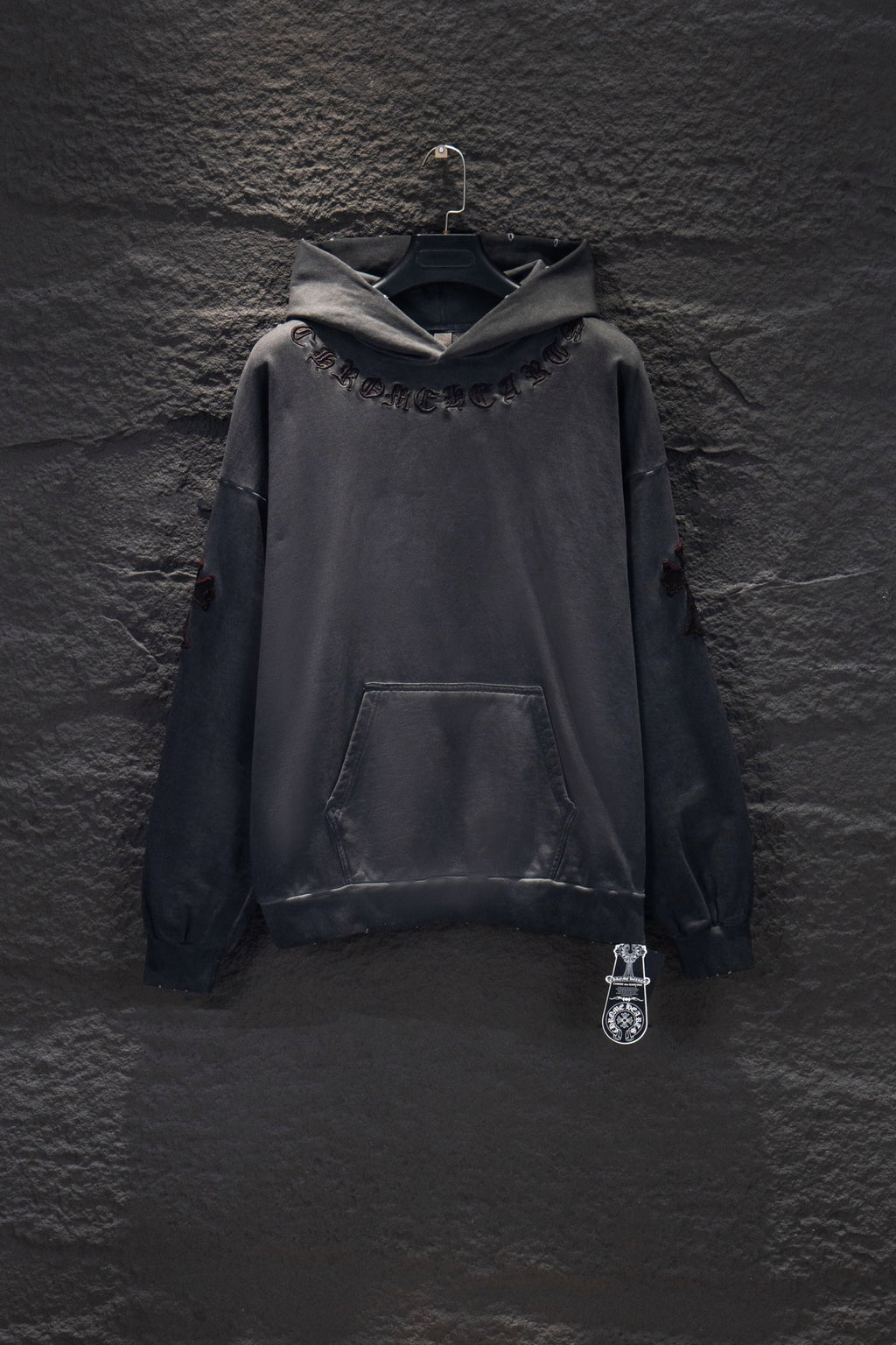 Dark gray long-sleeve hoodie with hood, front pocket, and chest logo embroidery