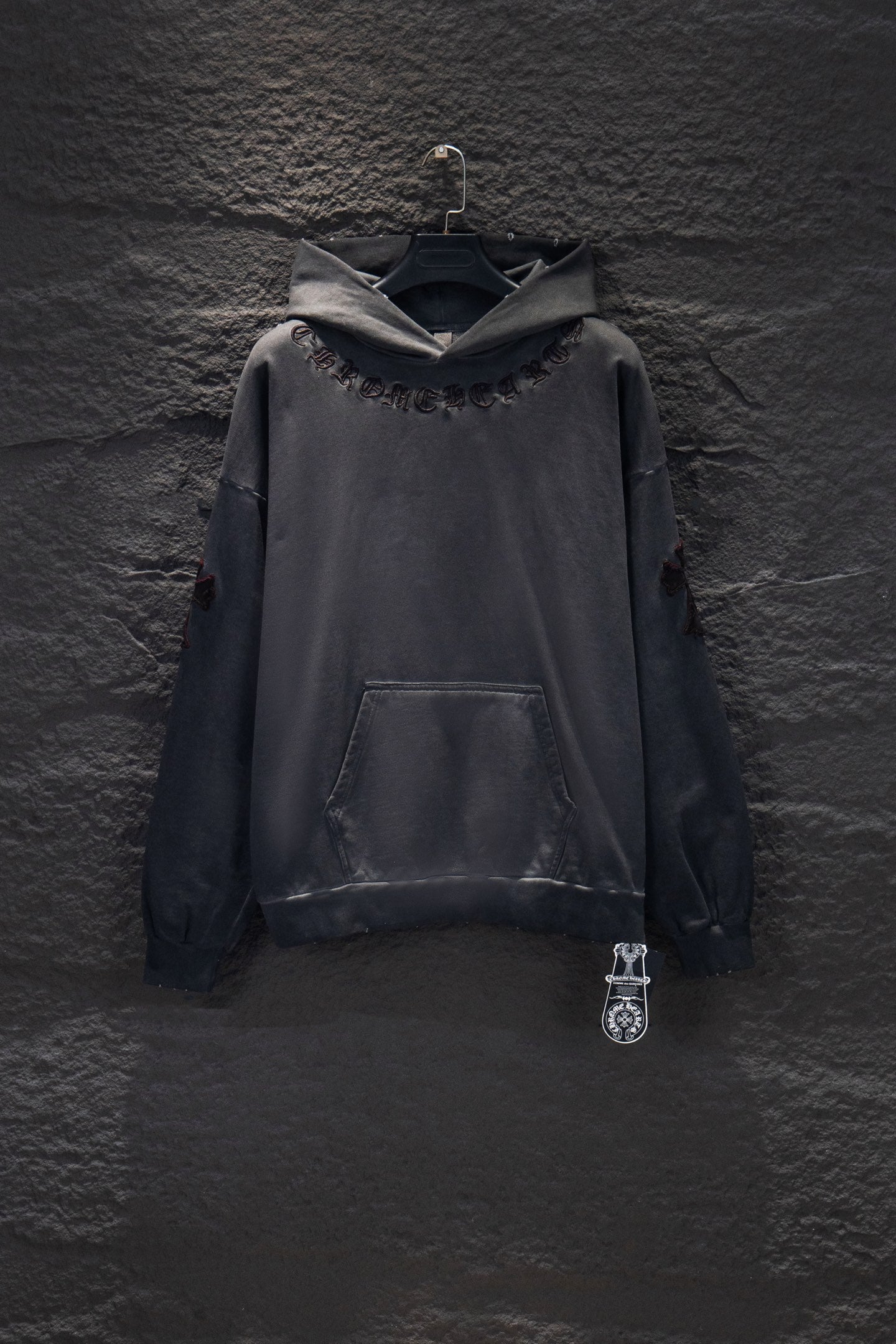 Dark gray long-sleeve hoodie with hood, front pocket, and chest logo embroidery