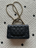 Quilted leather flap bag with gold-tone chain strap, black