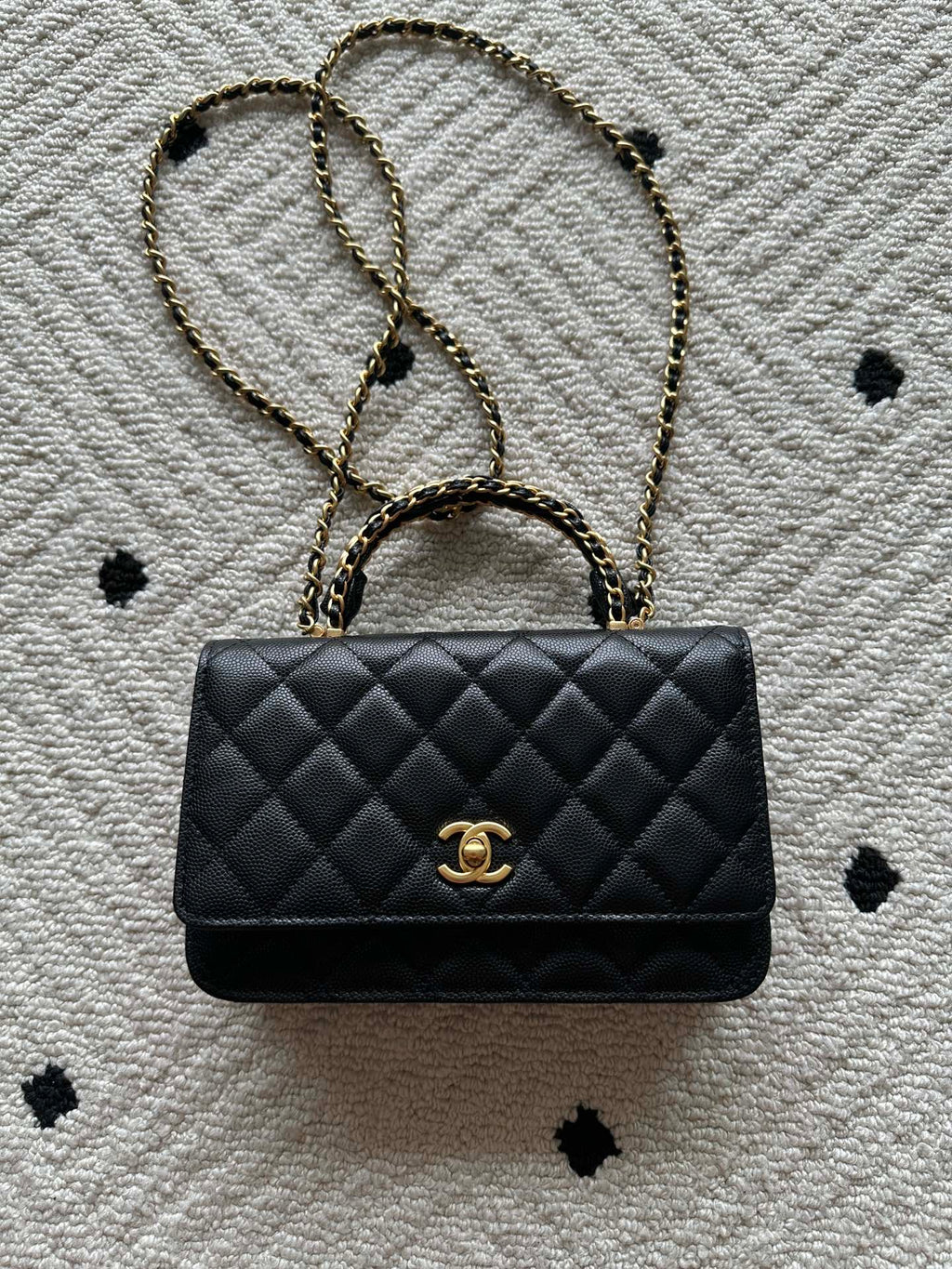 Quilted leather flap bag with gold-tone chain and Chanel CC clasp, black