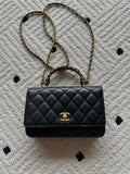 Quilted leather flap bag with gold-tone chain and Chanel CC clasp, black