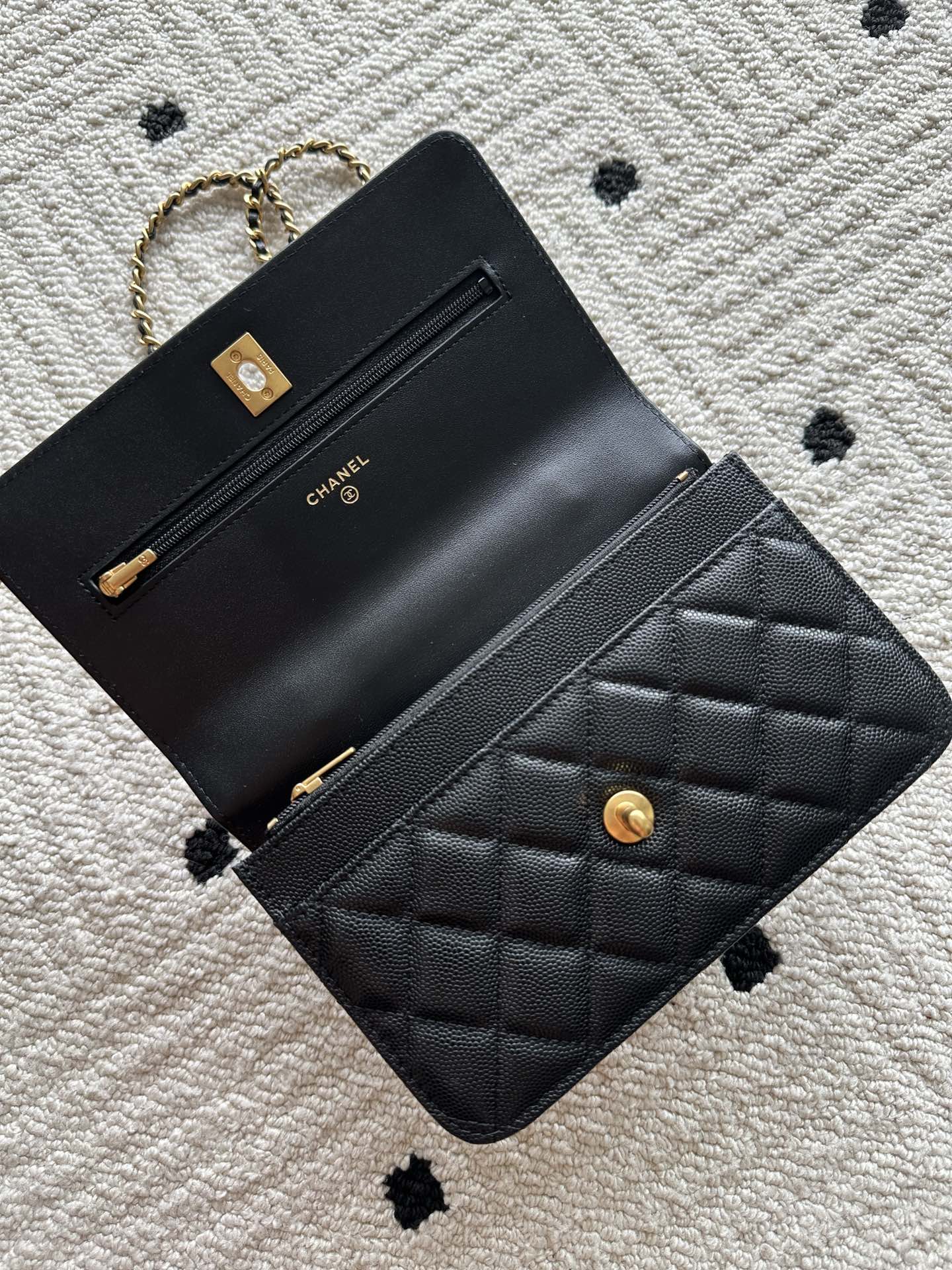 Quilted leather flap bag with gold-tone clasp and Chanel branding, black