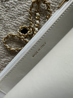 Chanel white bag close-up of MADE IN ITALY stamp along edge stitching