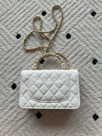 Chanel quilted white bag with chain strap and flap closure, single front panel