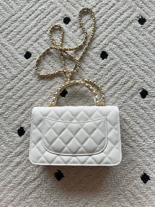 Chanel quilted white bag with chain strap and flap closure, single front panel
