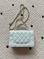 Chanel quilted mini bag, light blue, curved front flap with gold logo