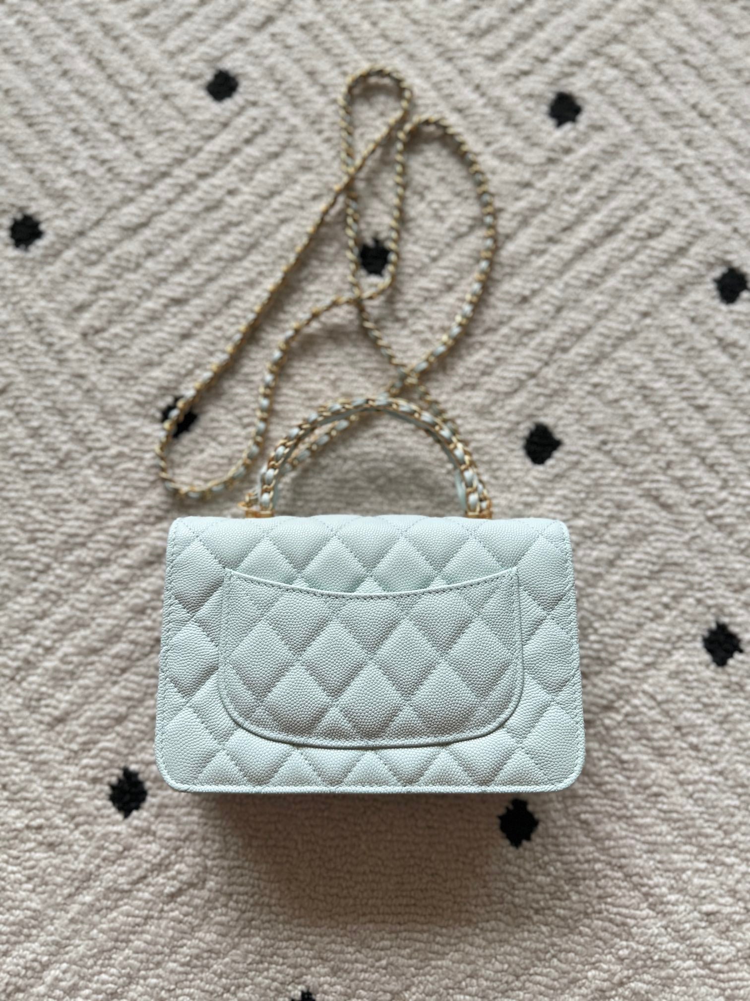 Chanel quilted mini bag, light blue, curved front flap with gold logo