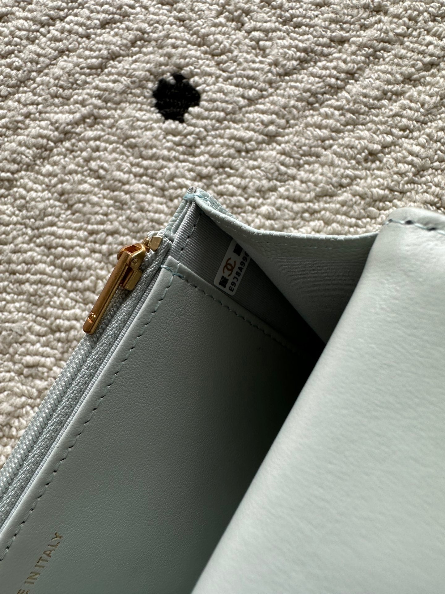 Chanel light blue interior corner with zip closure and stitched seam