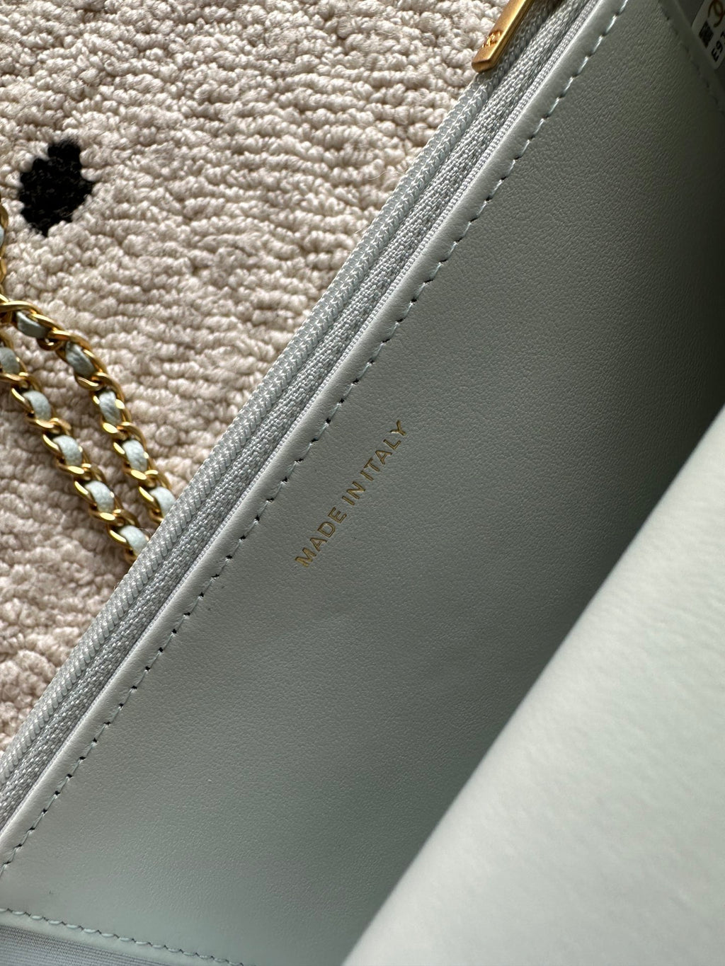 Chanel light blue bag side panel with embossed "MADE IN ITALY" text