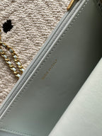 Chanel light blue bag side panel with embossed "MADE IN ITALY" text