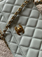 Chanel quilted mini flap bag, light blue, gold clasp and chain strap detail
