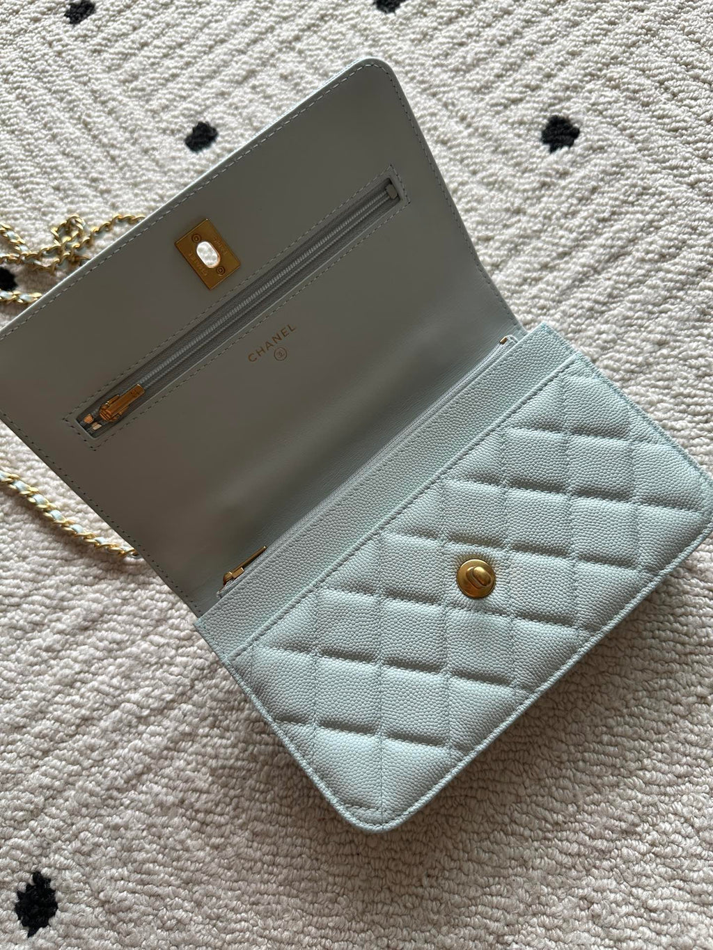 Chanel mini flap bag, light blue, open interior with card slot and lining