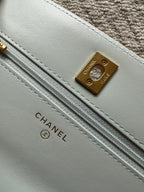 Chanel light blue leather strap panel with gold logo plate and long stitching