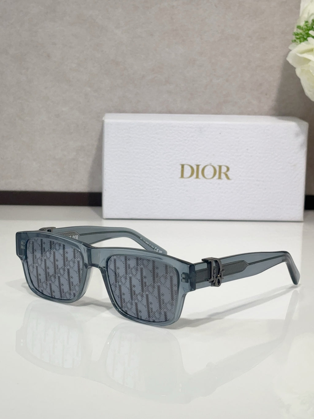 Dior sunglasses with dark blue frames and rectangular lenses
