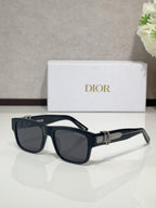 Dior sunglasses with dark blue frames and tinted lenses