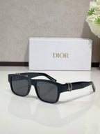 Dior sunglasses with navy frames and dark tinted lenses
