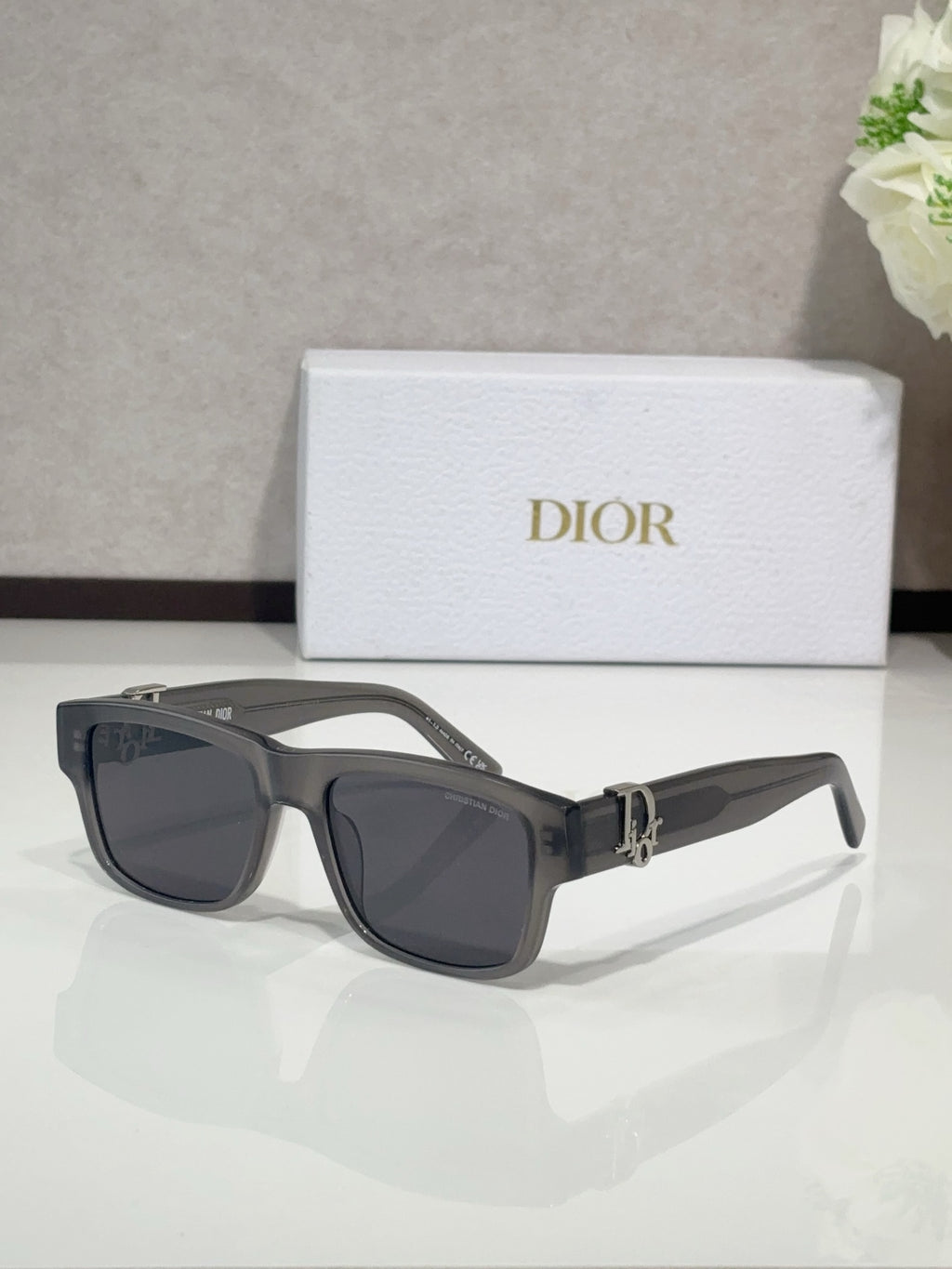 Dior sunglasses with black frames and dark tinted lenses