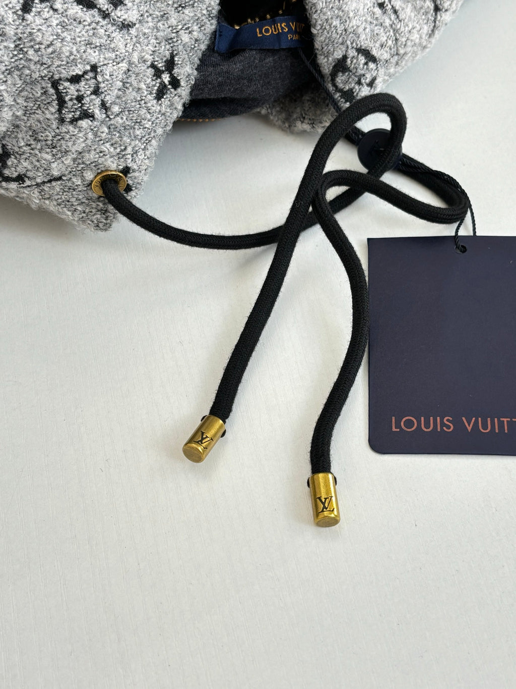Long Louis Vuitton top with black drawstring cords and gold aglet ends