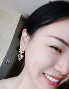 Single heart charm earring with gold-tone pendant and pink CC detail