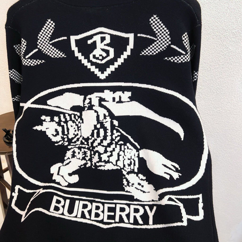 Black sweater with large Burberry horse graphic and check arrow motifs