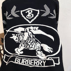 Black sweater with large Burberry horse graphic and check arrow motifs