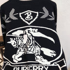 Black sweater showing Burberry crest, horse illustration, and ribbon text