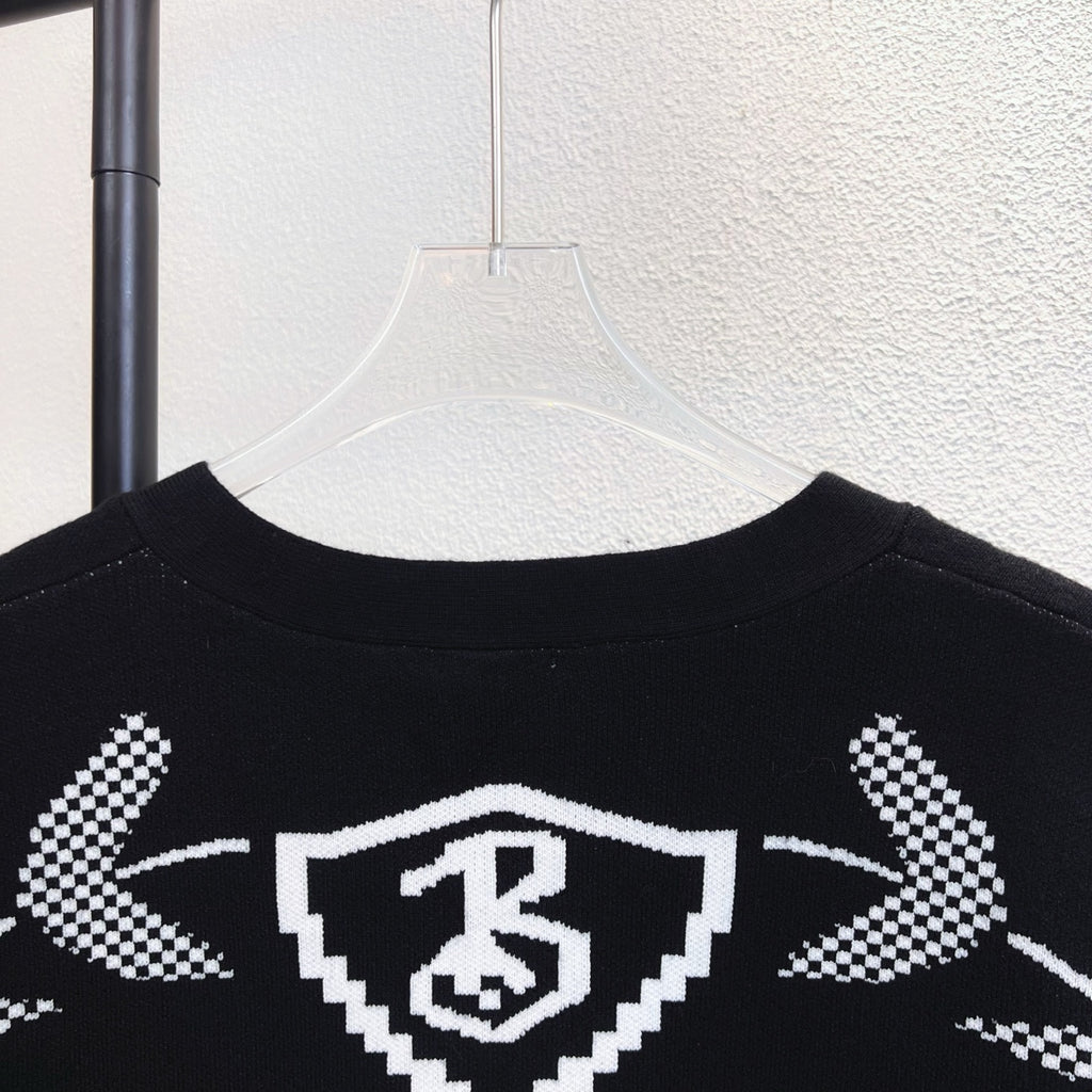 Black crew sweater with Burberry check crest graphic across upper back
