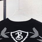 Black crew sweater with Burberry check crest graphic across upper back