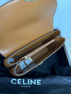Tan leather bag open interior with zipper pocket and hanging tags