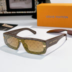 Louis Vuitton sunglasses with brown monogram frame and amber-tinted lenses