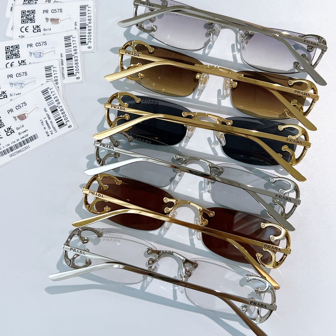 Prada glasses set with assorted metal frames and tinted lenses, stacked for display