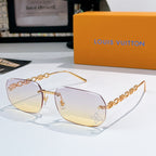 Louis Vuitton sunglasses with light yellow-tinted lenses, gold frame and chain arms