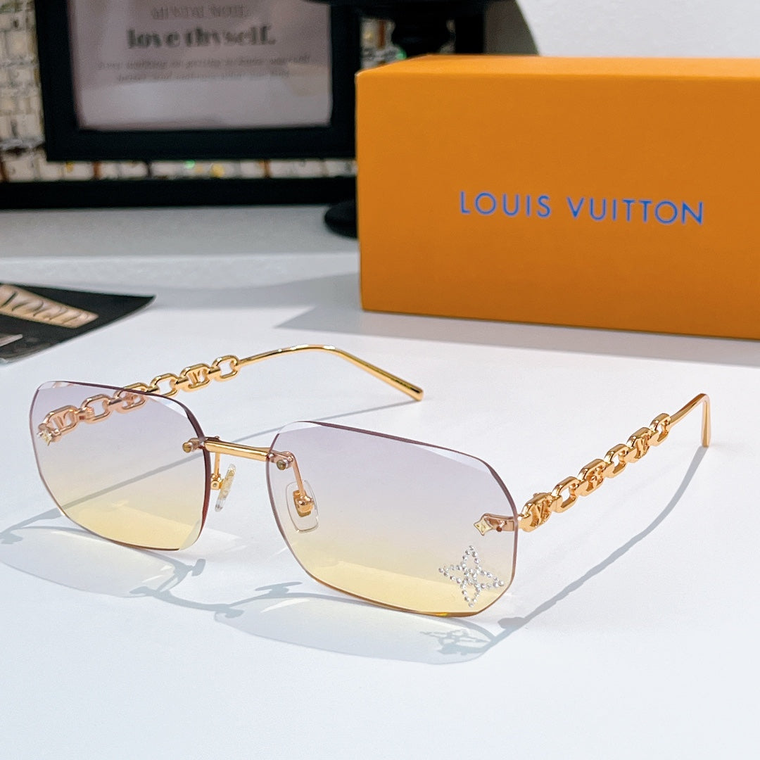 Louis Vuitton sunglasses with light yellow-tinted lenses, gold frame and chain arms