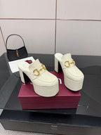 Gucci women’s platform mules, cream with gold buckle and chunky block heel