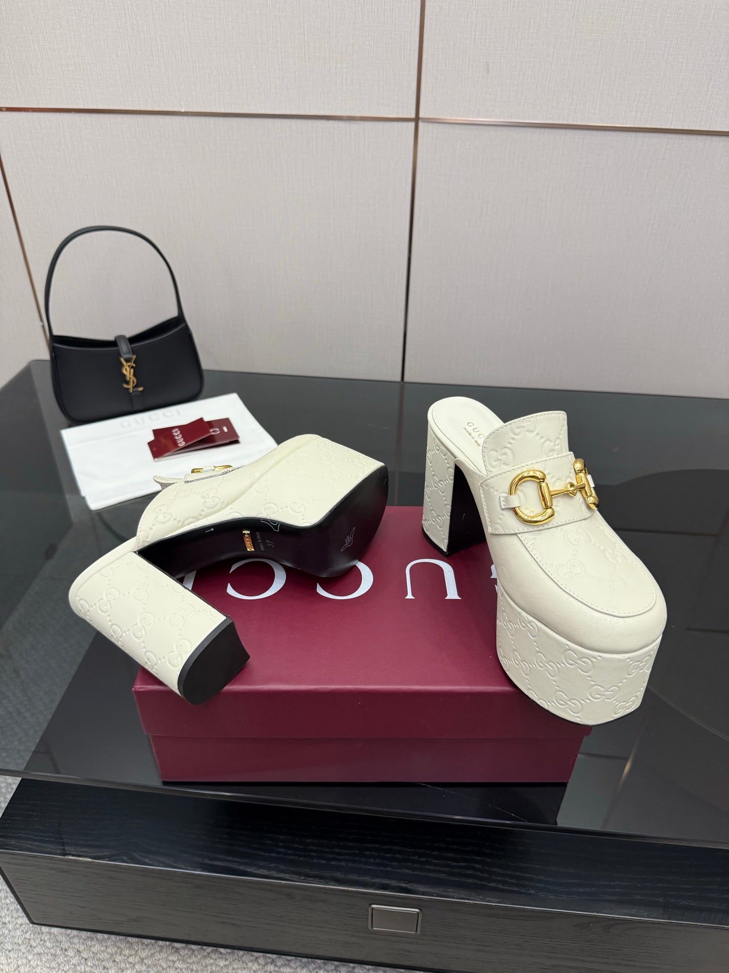 Gucci women’s platform mules pair, cream slip-ons with gold buckle on block heels