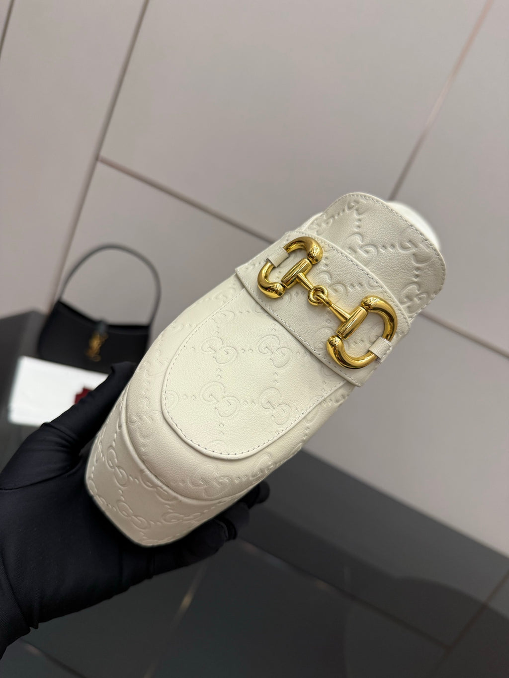 Gucci women’s platform mules, cream leather with gold double-buckle detail