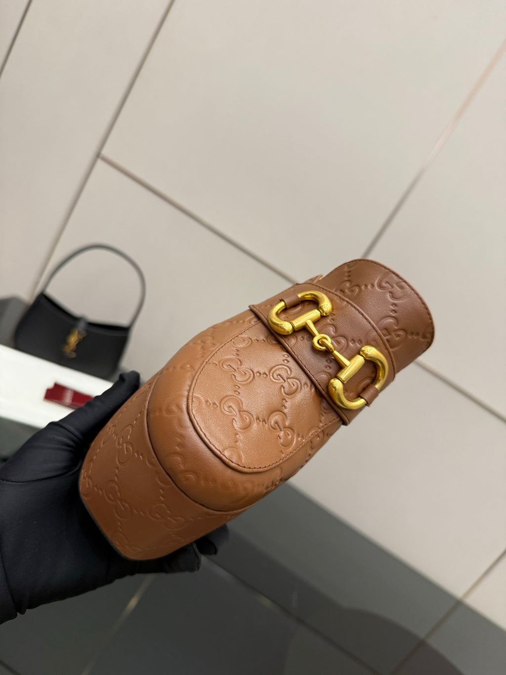 Tan/brown embossed mule sandal with gold double-buckle top strap on a platform sole
