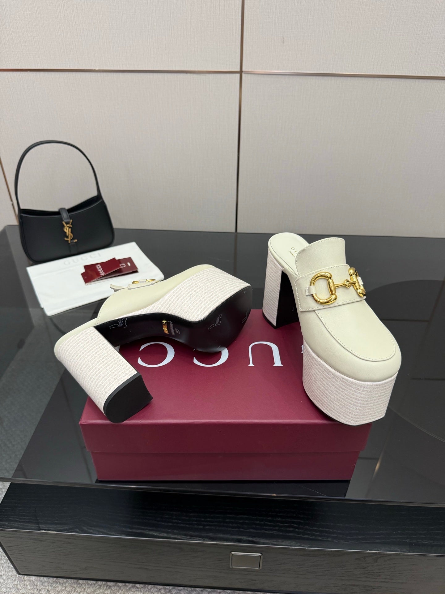 Gucci ladies off-white mule clogs with gold logo hardware, thick platform, and block heel