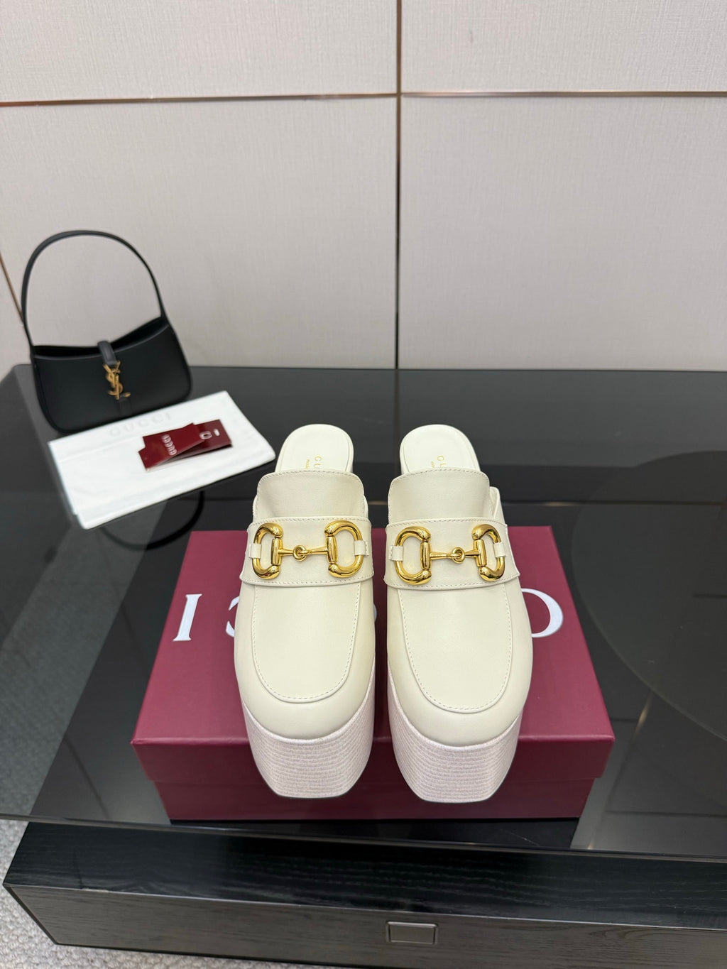 Gucci ladies platform mule clogs in off-white with gold logo hardware and thick heel