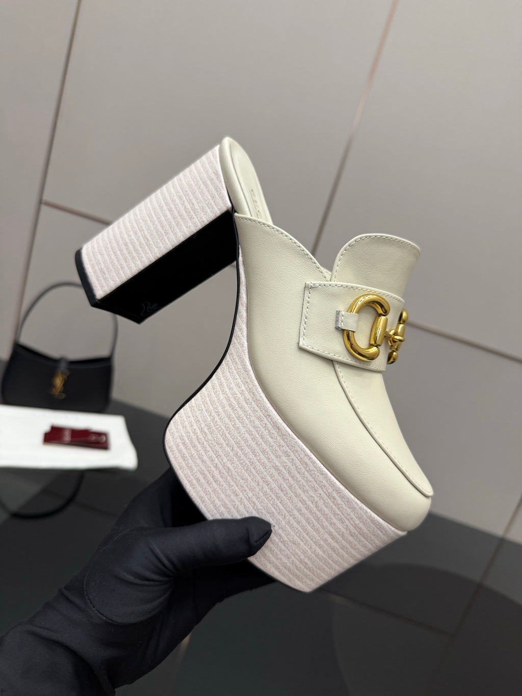 Gucci ladies off-white wedge mule clog with gold logo hardware and textured platform