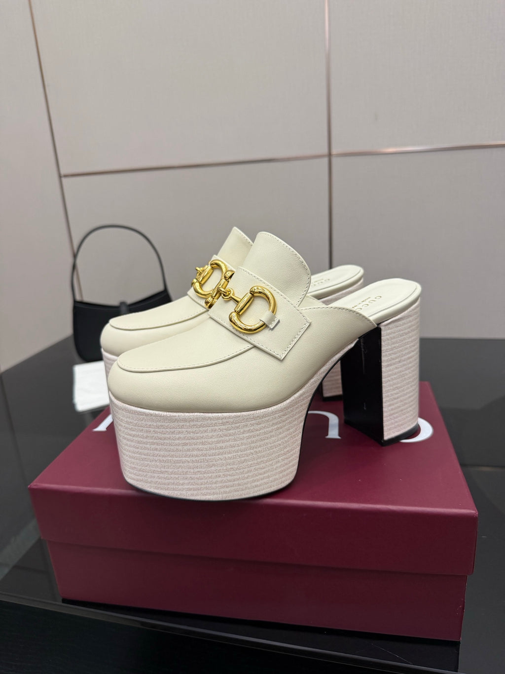 Gucci ladies off-white mule clog with gold logo hardware and textured platform block heel