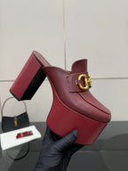 Burgundy Gucci platform mule with gold horsebit ornament and block heel