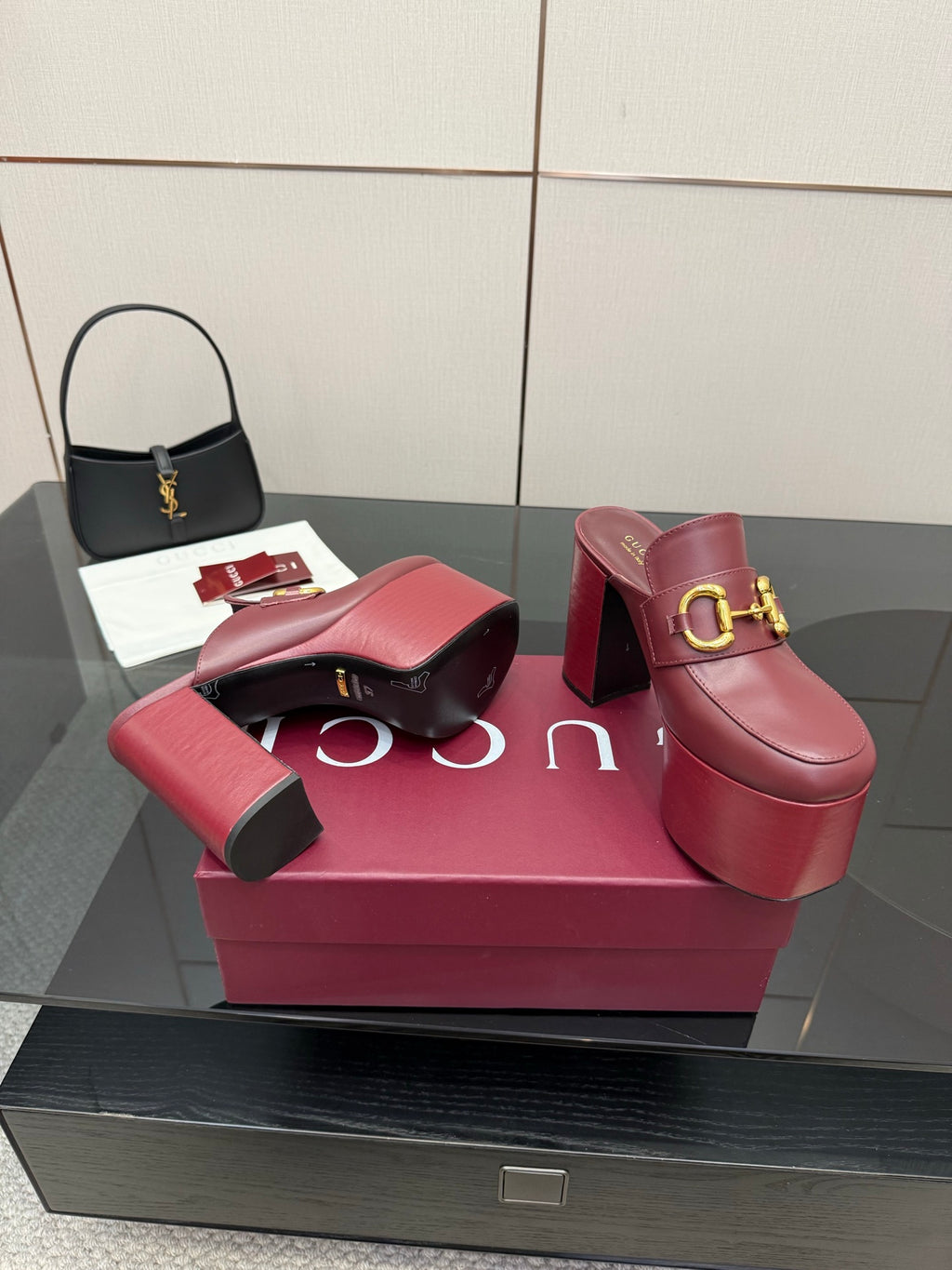 Burgundy Gucci platform mules with gold horsebit buckle and chunky block heel